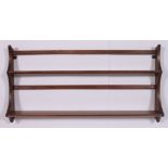 A vintage retro 1970's beech and elm wood plate rack in the Golden Dawn colour.