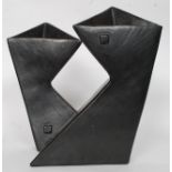 A pair of retro 1980's matt black modernist / studio angular matching vases