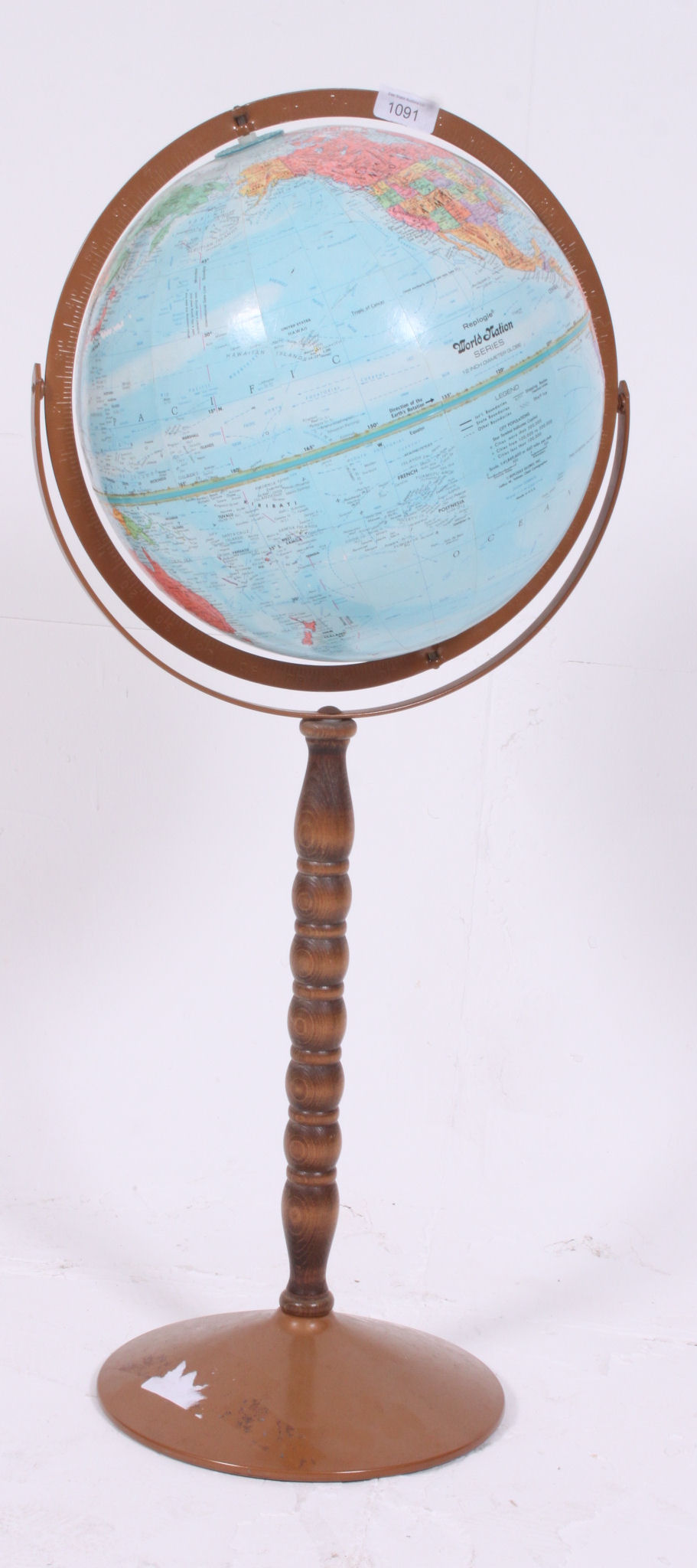 A vintage / retro floos standing Political Globe raised on a turned bobbin stand H80 W30 cm