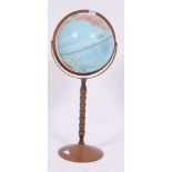 A vintage / retro floos standing Political Globe raised on a turned bobbin stand H80 W30 cm
