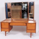 A good 1970's retro Danish influenced teak wood dressing table with triple mirror atop.