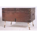 A 19th century steamer trunk with ebonised hinged brackets with hinged top H47 W69 D46cm