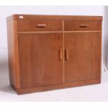 A Heals style 1930's Art Deco oak sideboard having rounded corners featuring 2 short drawers over