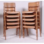 A stack of 10 retro 1950's ply panel wood Industrial school chairs raised on bentwood legs with