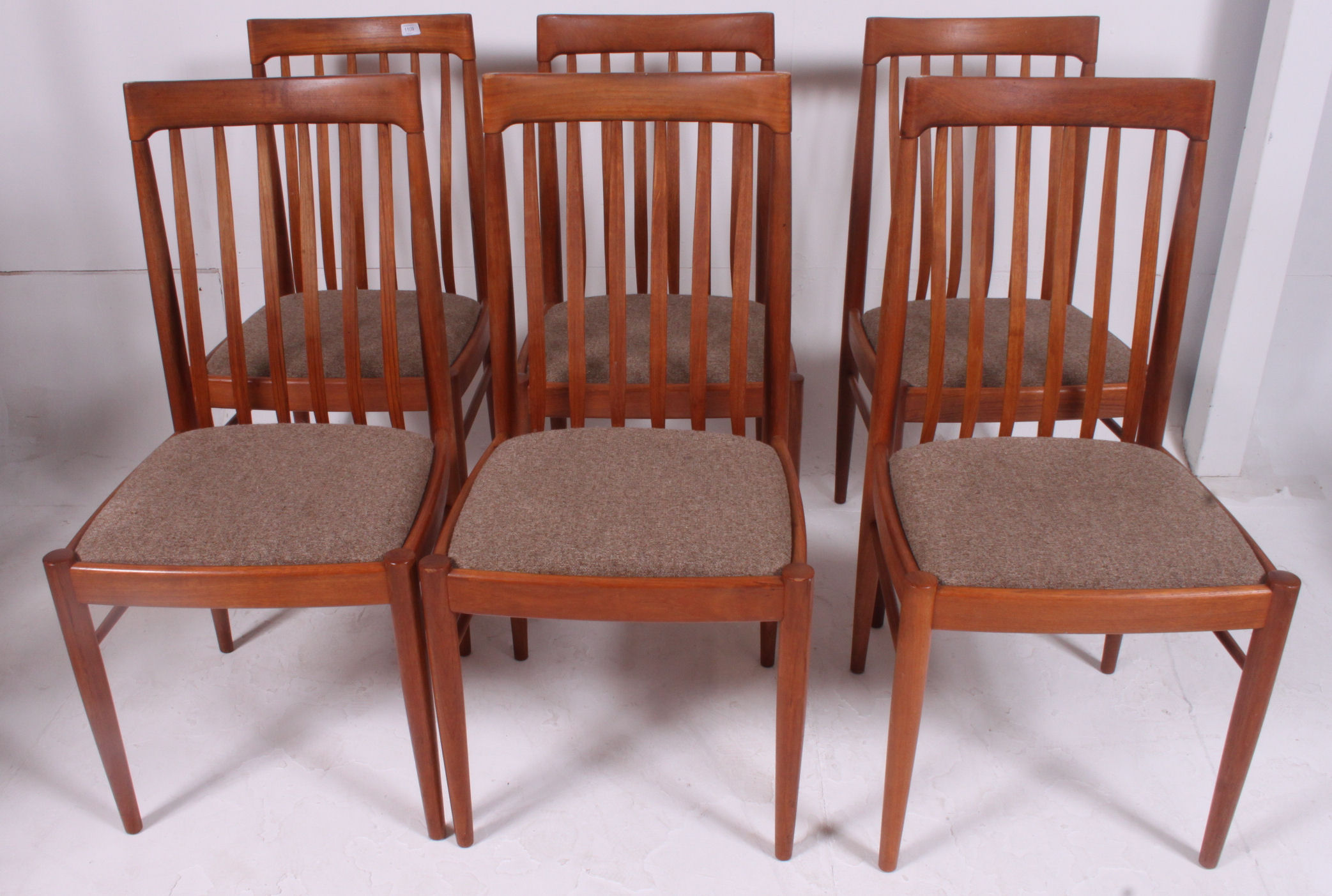 An excellent set of 6 1970's retro teak wood feather railed back Danish style chairs.