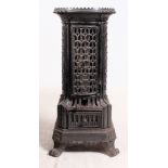 A French early 20th century enamel woodburning  / cylindrical coal stove having fret worked body