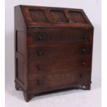 A Jaycee / Old Charm oak bureau writing desk in the Jacobean revival style.