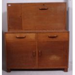 A fabulous 1920's oak school cupboard / cabinet raised on stub tapered supports with cabinet body