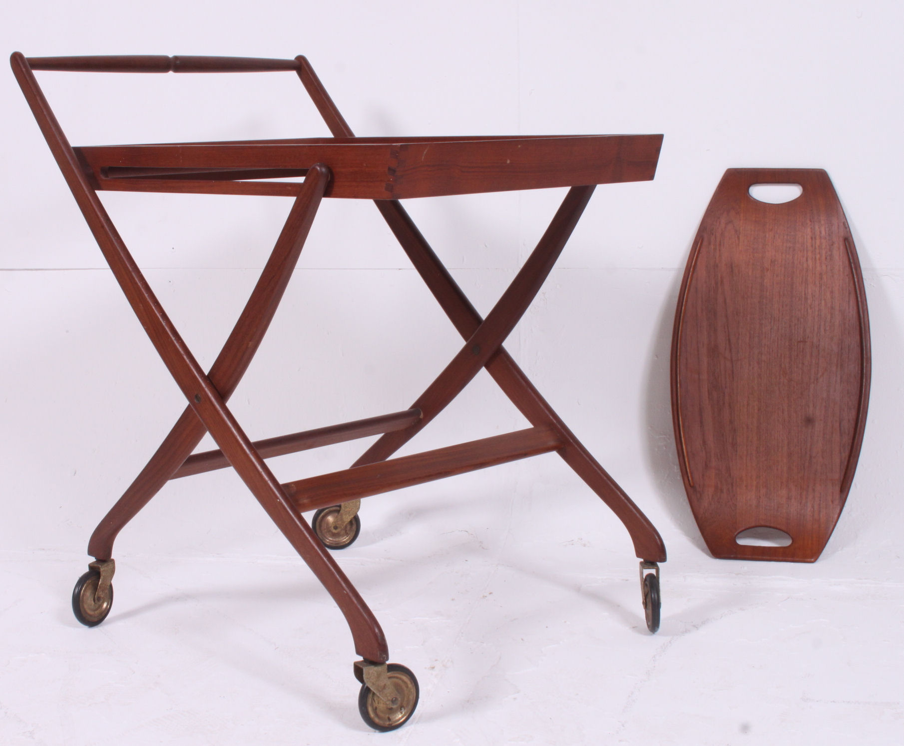 A retro teak wood collapsible buffet trolley along with a similar tray both stamped Denmark H75 W63