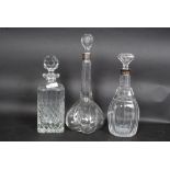 Two hallmarked silver collared decanters along with a lead crystal decanter