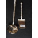 A Siam white metal ladle together with a matching cake slice being cast in repousse with chase