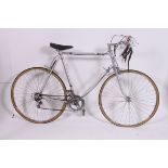 A retro 1970's road / racer push bike having drop handle bars 10 speed gears,