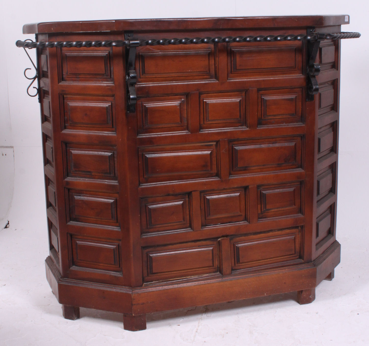 A vintage oak 1970's colonial style drinks bar / cocktail bar having geometric panelled front with