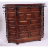 A vintage oak 1970's colonial style drinks bar / cocktail bar having geometric panelled front with