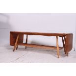 A very rare Ercol double extending drop end coffee table, solid Elm top,