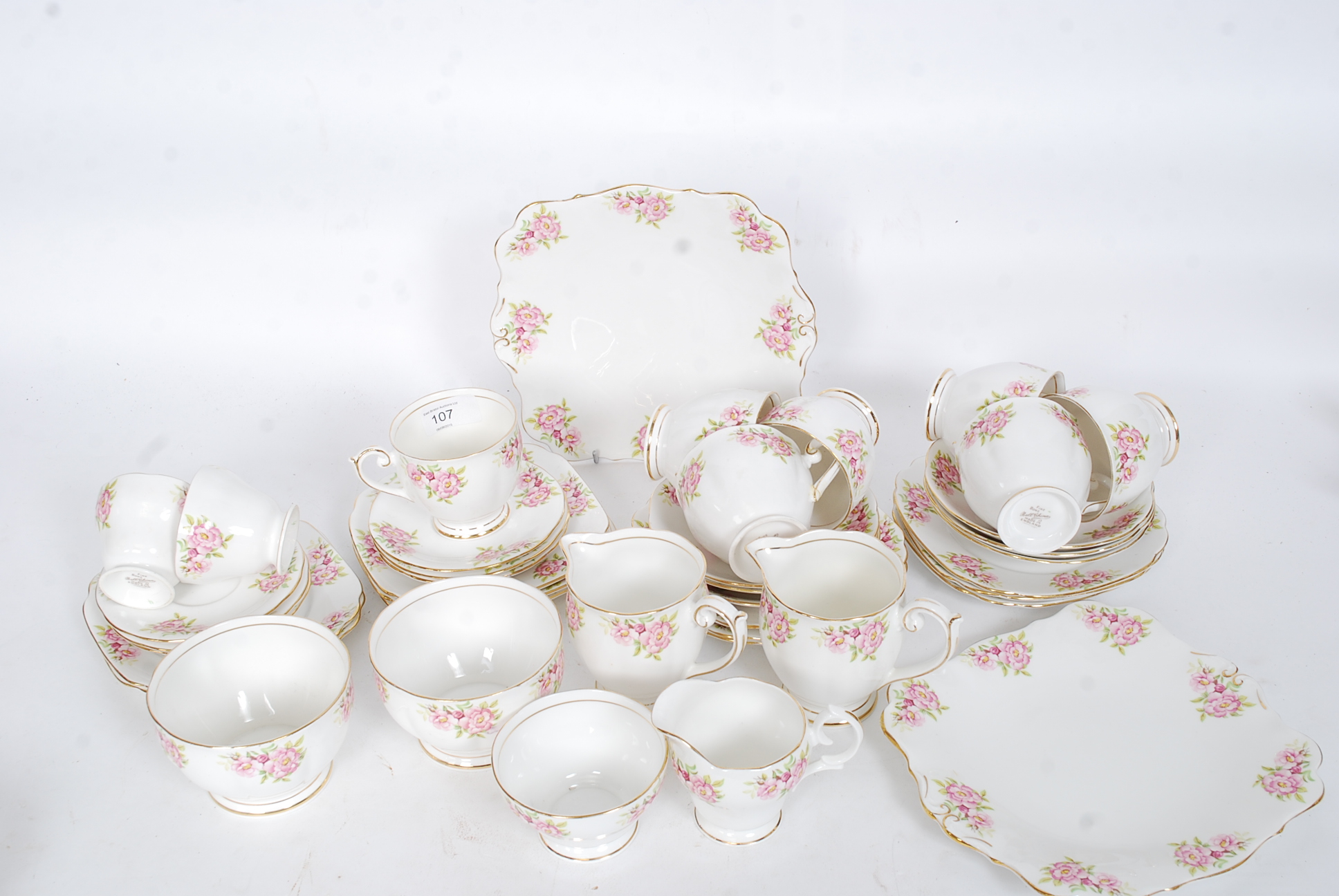 A vintage early 20th century ' Bell China ' chintz pattern part tea service comprising cups,