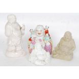 A collection of 4x vintage ceramic Buddha figurines.