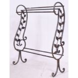 A wrought iron effect Victorian style towel rail