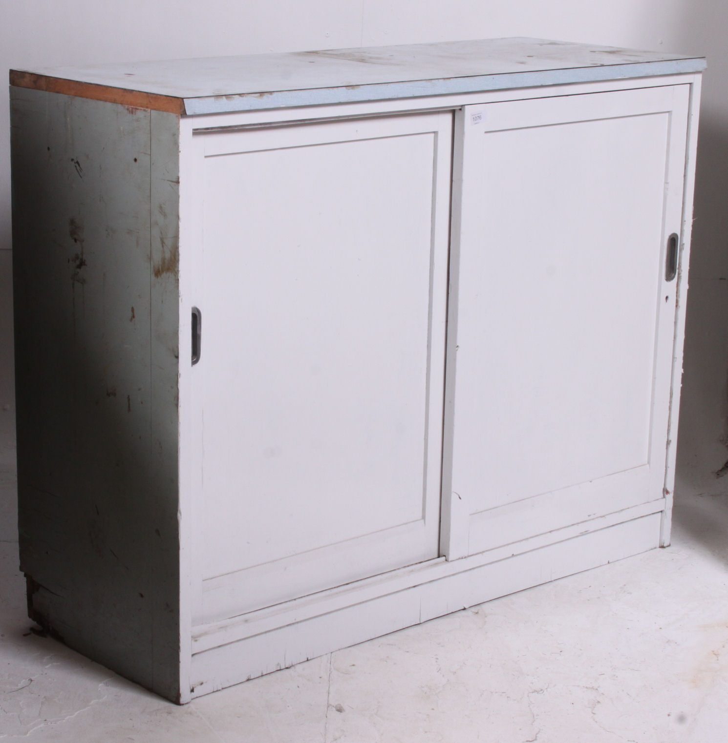 A painted mid 20th century school cupboard.