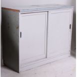 A painted mid 20th century school cupboard.