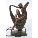 An art deco style lamp off a sitting lady in an undressed manor H38cm