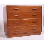 A utility / bombed out Britain straight four chest of drawers in oak raised on a plinth