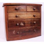 A Victorian bow front mahogany chest of drawers.