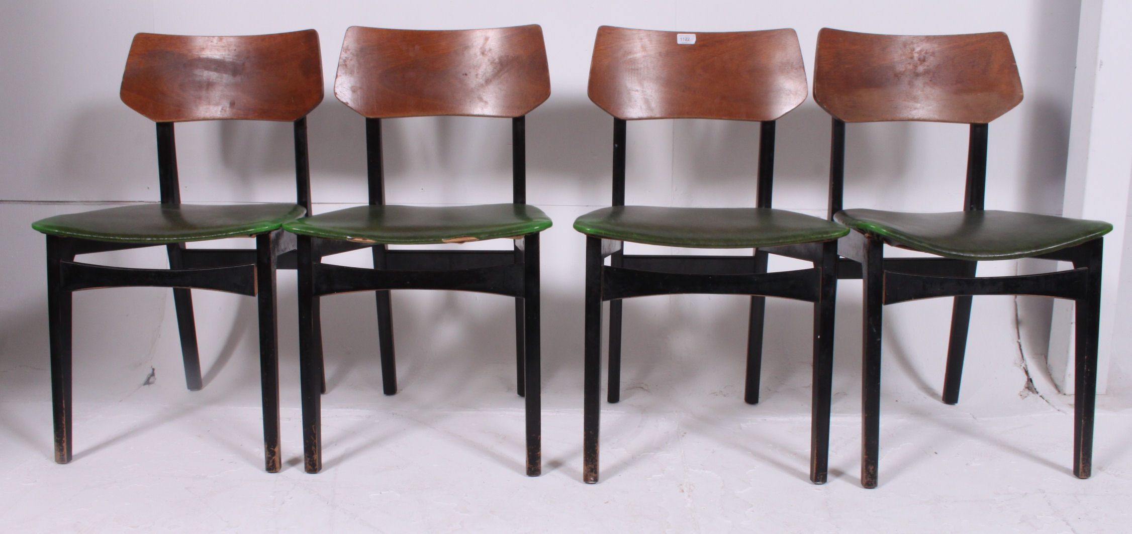 A set of 4 1960's G-Plan green velour and ebonised panel back dining chairs.