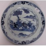 A 19th century Chinese blue and white kang-xi style large plate having central figures under tree