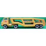 A vintage Tonka car transporter in yello