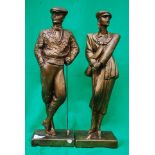 Two statues of a male and a female golfe