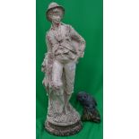 A stone garden ornament of a girl with a