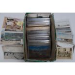 An assorted box of various vintage postcards,