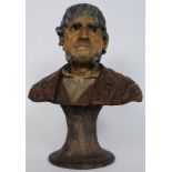 A large 20th century decorative Portuguese bust of Ze Povinho in terracotta / pottery.