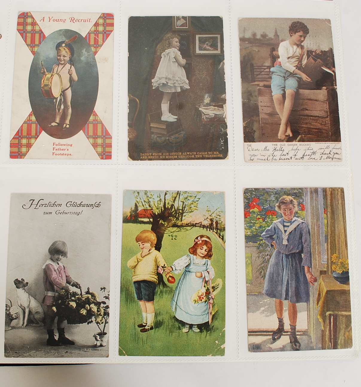 Large album with 250 vintage postcards of children. Some sets.