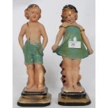 A pair of chalk work / plaster work bookends of a boy and girl with RD No 795542 to the base.