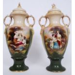 A pair of Victorian large Staffordshire twin handled urns complete with the lids having classical