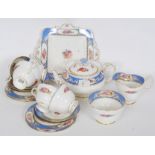 A pretty Paragon blue and white tea service, comprising of five trios, teapot, cake plate,