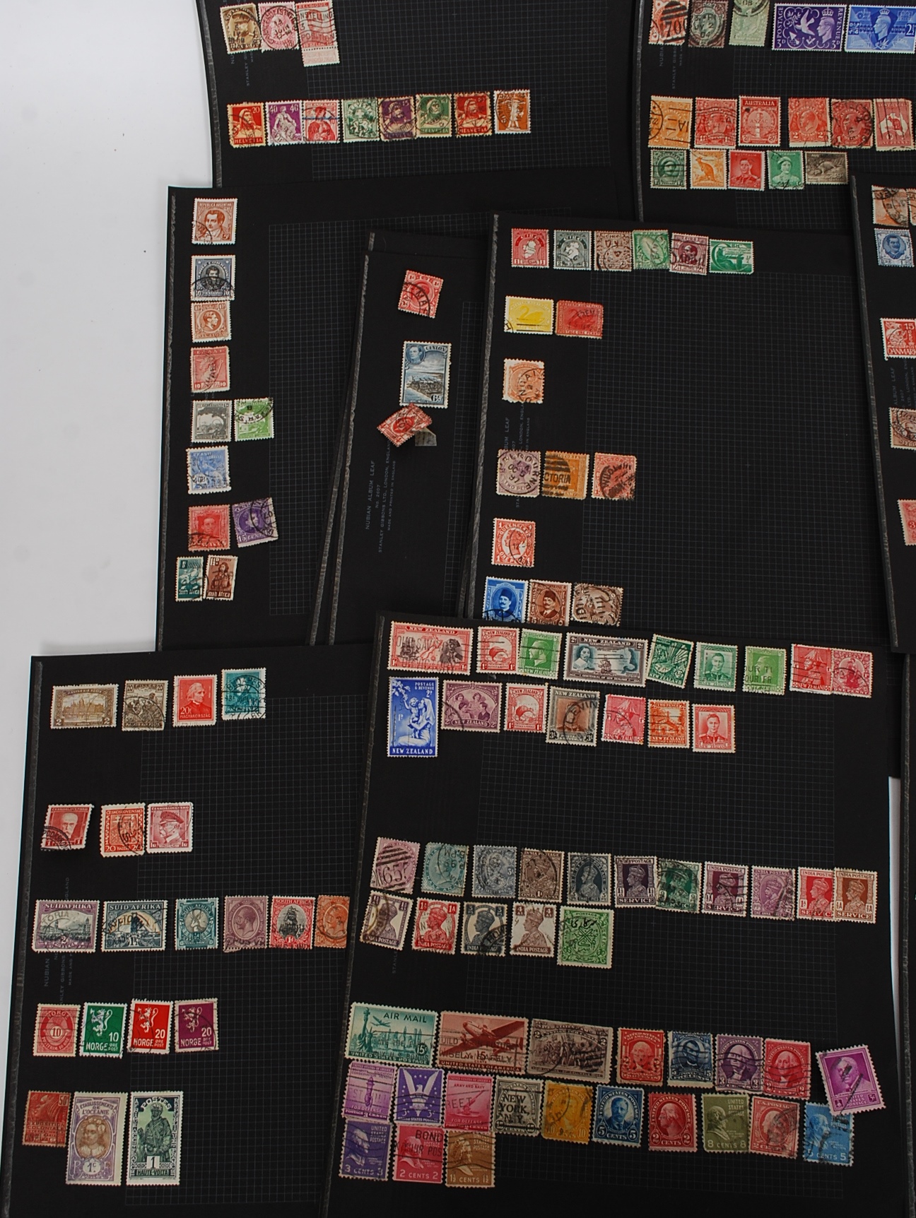 A collection of stamps on black boards to include New Zealand, India, American, Canada, German, - Image 3 of 4