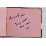 A vintage autograph book featuring the autographs from the show ' Radio Times ' including Larry