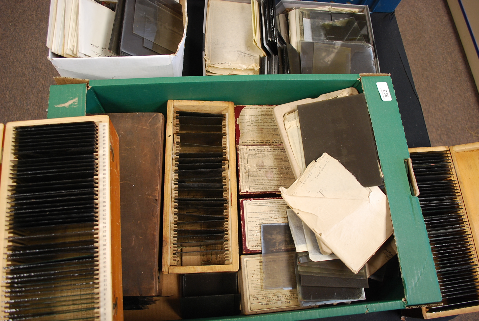 A large collection spanning three boxes of Victorian and early 20th century photographic glass