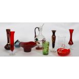 A collection of cranberry glass items to include stem vases, solifleur,