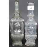 Two Victorian hand blown glass bottles depicting Queen Victoria and Prince  Albert along with other