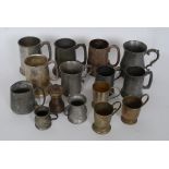 A collection of pewter and silver plate tankards from the 19th and 20th century to include various