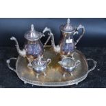 A silver plated tea service comprising of coffee pot, tea pot, sugar bowl, tray and milk jug.