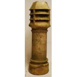 A very large Victorian stoneware chimney pot, tall round stem with fluted vented top. 120cm tall.