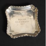 A silver hallmarked pin tray having incised notation for Boxing R.M.A. & Belsize 1937.