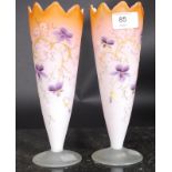 A pair of hand painted tapered vases.