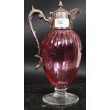 A 19th century Regency style silver plated cranberry claret jug with shaped handle and decorative