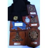 A collection of International Police Association wooden plaques to include Royal Canadian Mountain